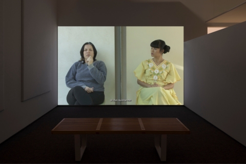 LED Screen of two women seated