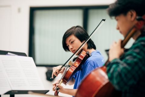 Student playing violin